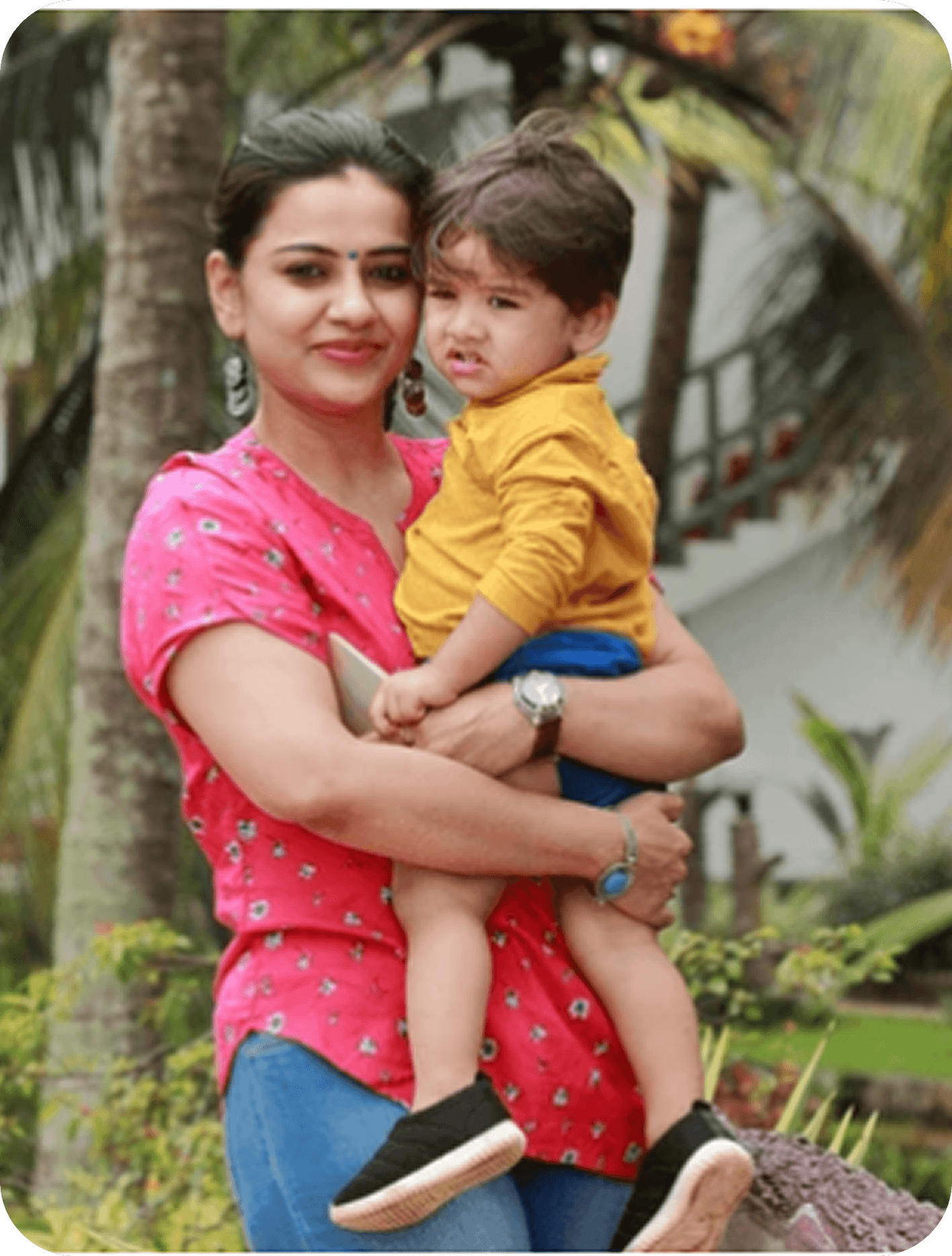 Mother holding her child outdoors
