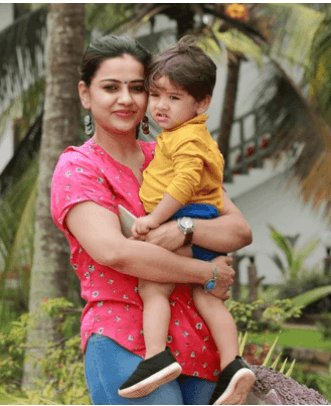 Mother holding her child outdoors